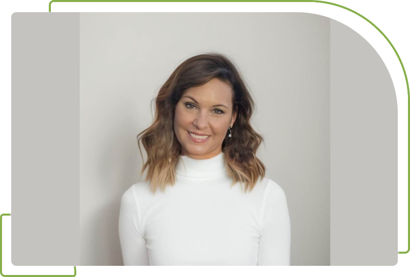 A woman in white shirt smiling for the camera.